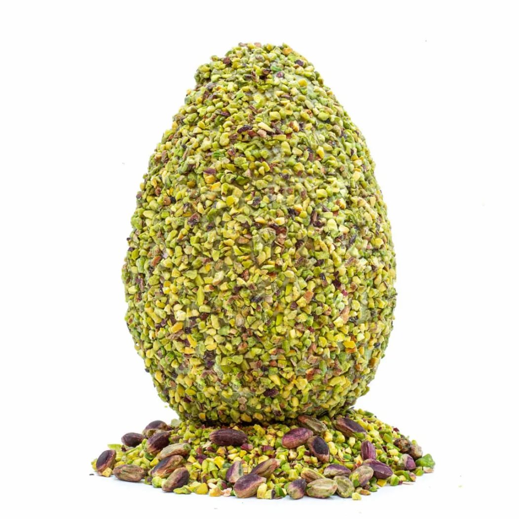 Uovo Di Pasqua al pistacchio con sorpresa all'interno in elagente scatola regalo. Realizzato con pregiato cioccolato senza l'utilizzo di surrogato. Prodotto di qualità